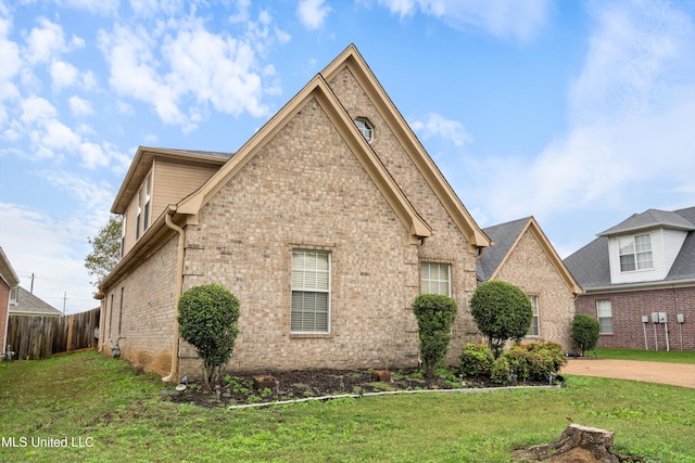 view of property exterior featuring a yard