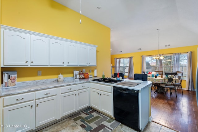 kitchen with white cabinetry, kitchen peninsula, and black dishwasher