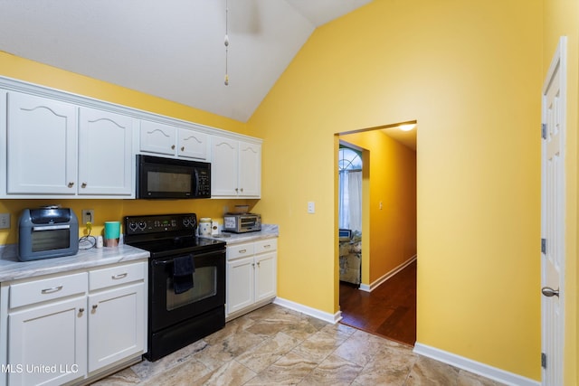 kitchen featuring white cabinetry, black appliances, and high vaulted ceiling