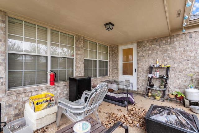 view of patio / terrace with an outdoor fire pit