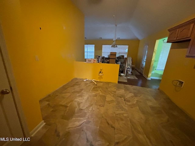 interior space featuring hardwood / wood-style floors and lofted ceiling