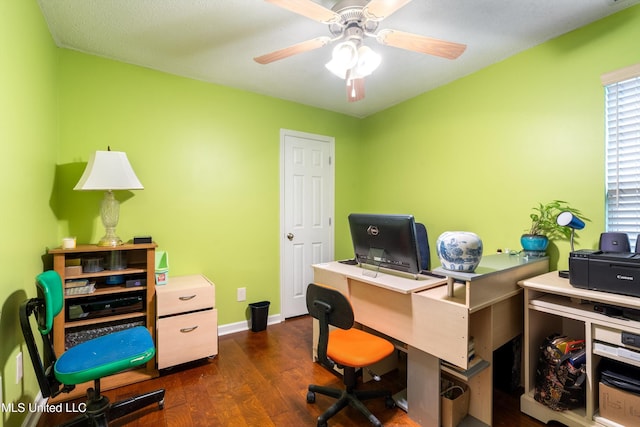 office space featuring a textured ceiling, dark wood-type flooring, and ceiling fan