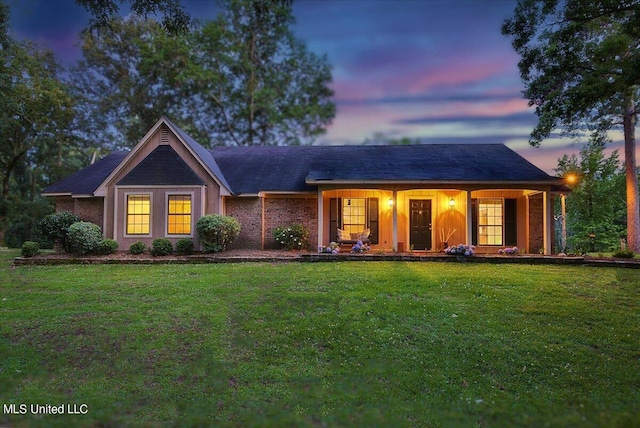 ranch-style house featuring a yard