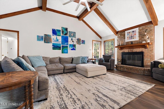 living room featuring a fireplace, hardwood / wood-style floors, ceiling fan, beamed ceiling, and high vaulted ceiling