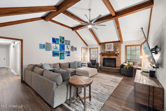 living room featuring beamed ceiling, ceiling fan, dark wood-style flooring, a fireplace, and high vaulted ceiling