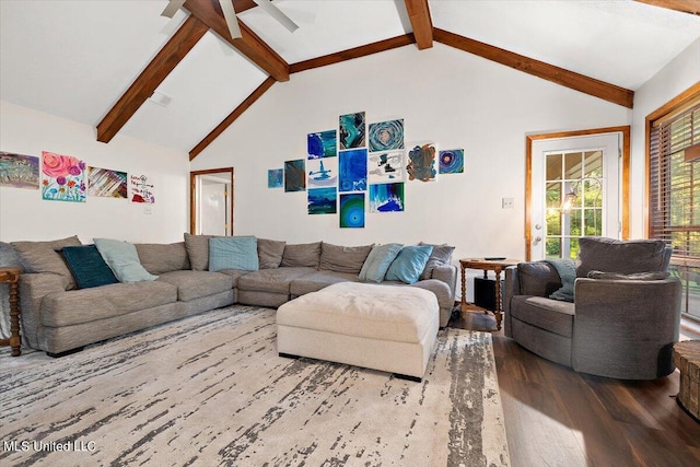 living area featuring wood finished floors, a ceiling fan, and lofted ceiling with beams