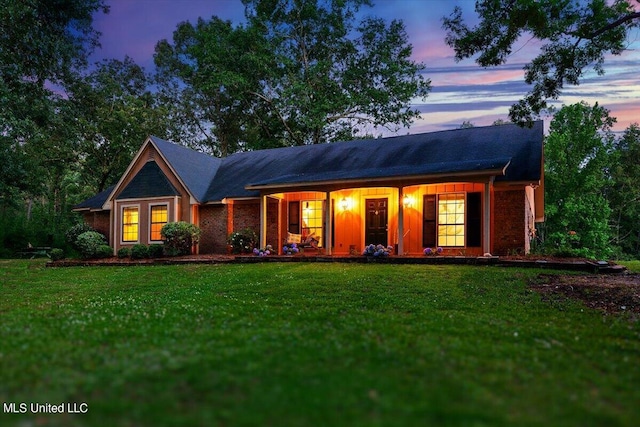 view of front of property with a lawn