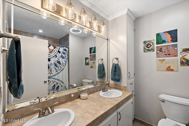 bathroom featuring curtained shower, a textured ceiling, toilet, vanity, and ornamental molding