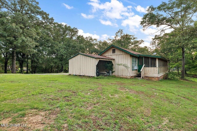 view of property exterior featuring a sunroom and a yard