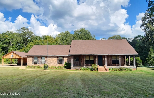 ranch-style house with a front yard and covered porch