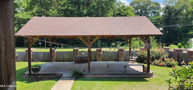 view of home's community featuring a gazebo, a wooden deck, and a yard