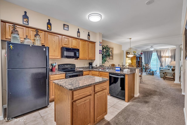 kitchen with black appliances, hanging light fixtures, crown molding, and a kitchen island