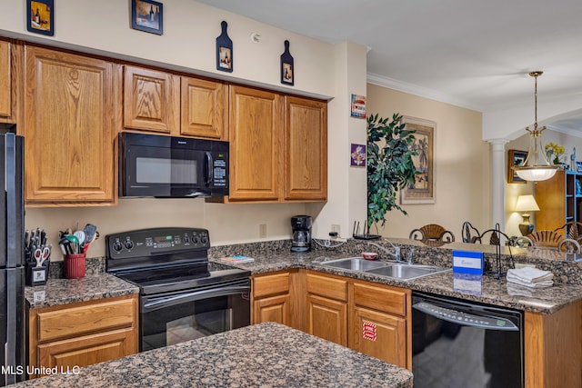 kitchen with decorative columns, dark stone countertops, black appliances, crown molding, and sink