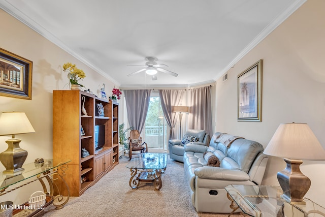 living room featuring ornamental molding, carpet, and ceiling fan