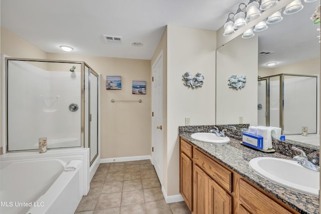 full bath featuring visible vents, a sink, baseboards, and a shower stall