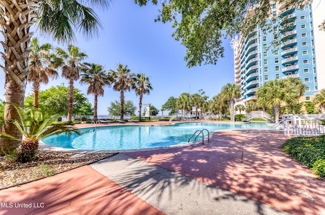 pool featuring a patio area
