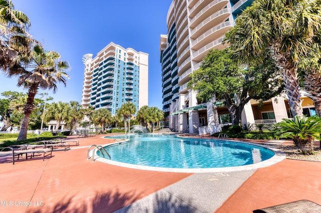 view of swimming pool with a patio