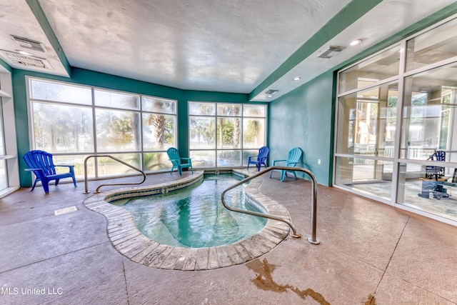 view of pool featuring a pool and an indoor hot tub