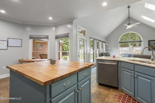 410 Woodland Hills Ct, Madison, MS 39110 - kitchen featuring dishwasher, wooden counters, open floor plan, a ceiling fan, and a center island