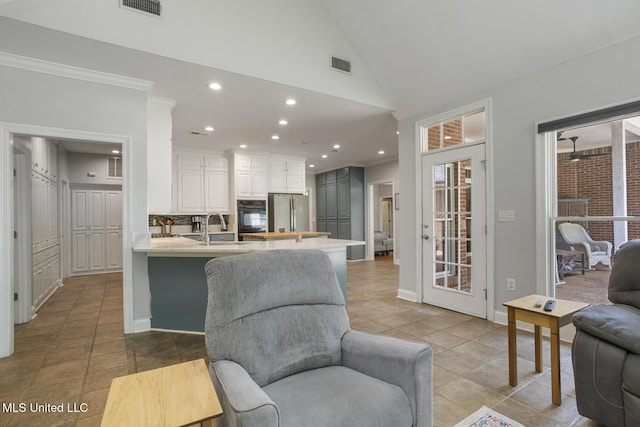 410 Woodland Hills Ct, Madison, MS 39110 - living room with recessed lighting, ornamental molding, light tile patterned flooring, and high vaulted ceiling