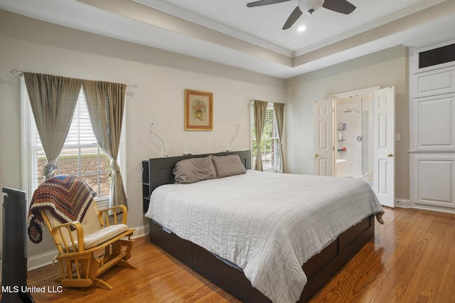 410 Woodland Hills Ct, Madison, MS 39110 - bedroom featuring multiple windows, a tray ceiling, crown molding, wood finished floors, and recessed lighting