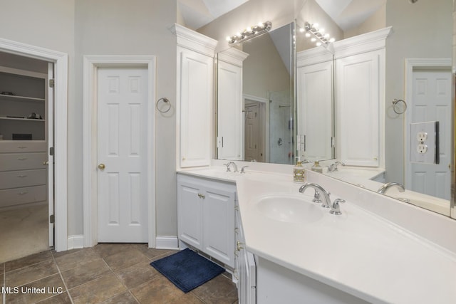 410 Woodland Hills Ct, Madison, MS 39110 - full bathroom with double vanity and lofted ceiling