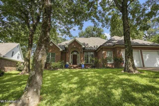 410 Woodland Hills Ct, Madison, MS 39110 - view of front facade featuring brick siding, a garage, a front lawn, a shingled roof, and driveway