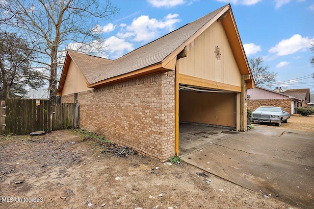 view of side of home with a garage