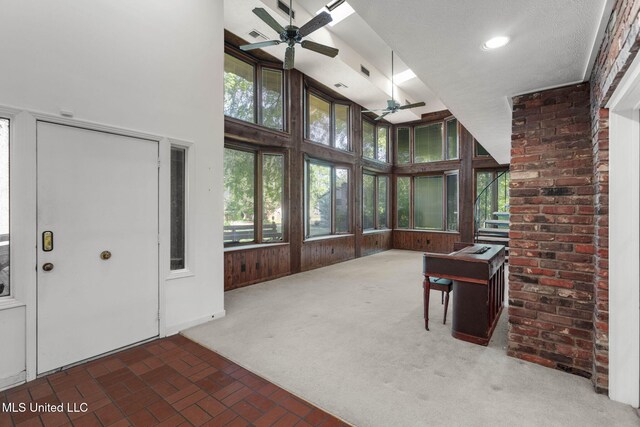 160 Marblehead Ct, Jackson, MS 39211 - unfurnished sunroom featuring a ceiling fan, a high ceiling, and brick patterned floors