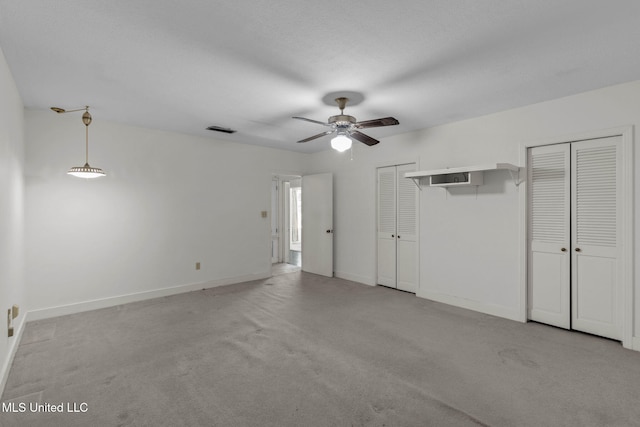 160 Marblehead Ct, Jackson, MS 39211 - unfurnished bedroom with light colored carpet, multiple closets, and ceiling fan