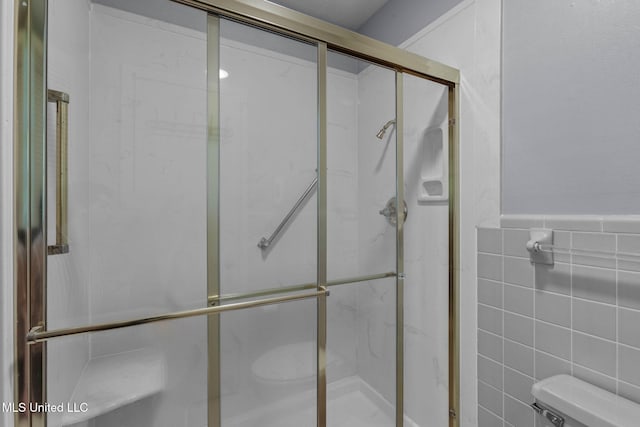 160 Marblehead Ct, Jackson, MS 39211 - bathroom featuring tile walls and a stall shower