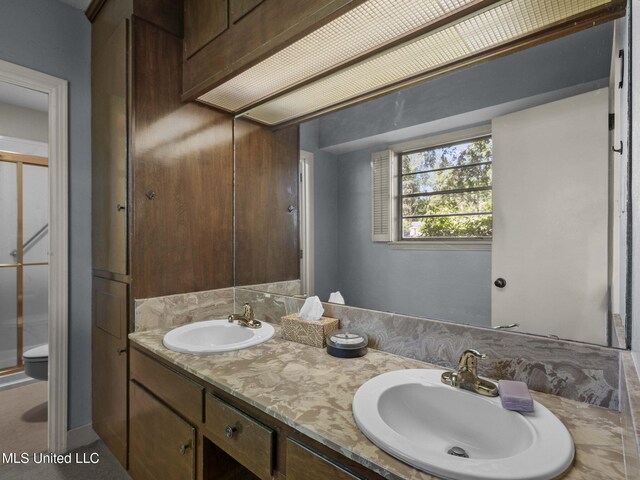 160 Marblehead Ct, Jackson, MS 39211 - bathroom featuring double vanity and toilet