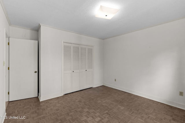 160 Marblehead Ct, Jackson, MS 39211 - unfurnished bedroom with a closet, ornamental molding, and a textured ceiling
