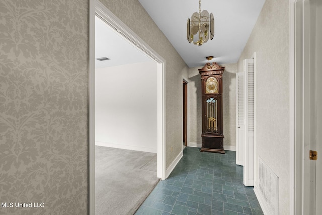 160 Marblehead Ct, Jackson, MS 39211 - corridor featuring wallpapered walls and a chandelier