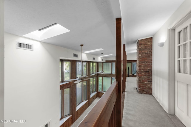 160 Marblehead Ct, Jackson, MS 39211 - corridor featuring a skylight and carpet floors