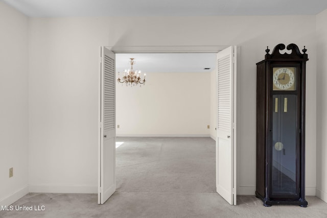 160 Marblehead Ct, Jackson, MS 39211 - hall featuring light colored carpet and a chandelier