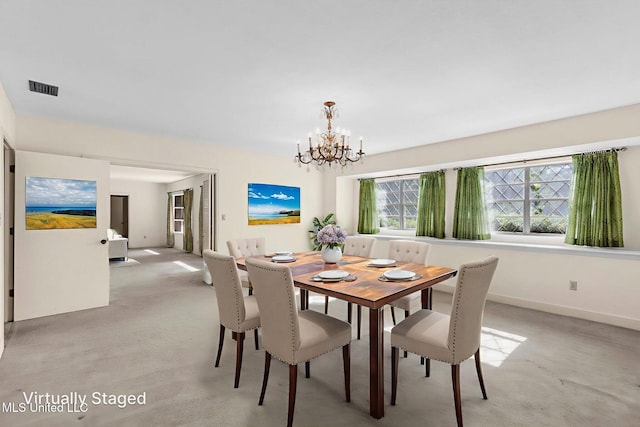 160 Marblehead Ct, Jackson, MS 39211 - dining room with light carpet and a chandelier