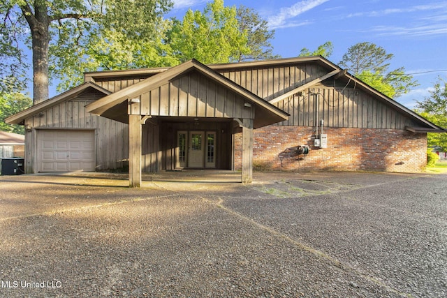 160 Marblehead Ct, Jackson, MS 39211 - view of front of property featuring brick siding, board and batten siding, and driveway