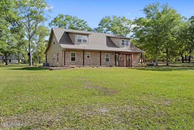 24023 Robert E Lee Rd, Lucedale, MS 39452 - view of front of house featuring cooling unit, brick siding, and a front lawn