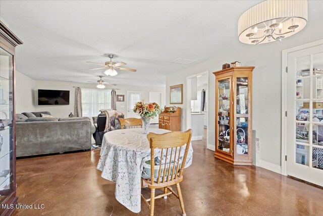 24023 Robert E Lee Rd, Lucedale, MS 39452 - dining room with ceiling fan, finished concrete floors, visible vents, and baseboards
