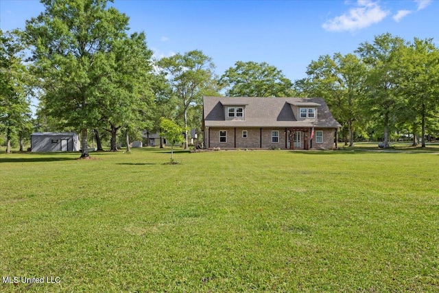 24023 Robert E Lee Rd, Lucedale, MS 39452 - view of front of home with a front yard and an outbuilding