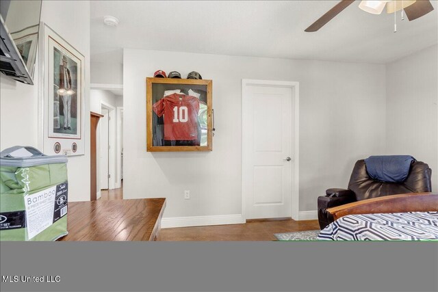 24023 Robert E Lee Rd, Lucedale, MS 39452 - bedroom featuring ceiling fan, wood finished floors, and baseboards