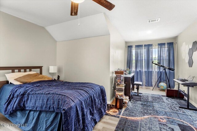 24023 Robert E Lee Rd, Lucedale, MS 39452 - bedroom featuring a ceiling fan, visible vents, vaulted ceiling, baseboards, and wood finished floors