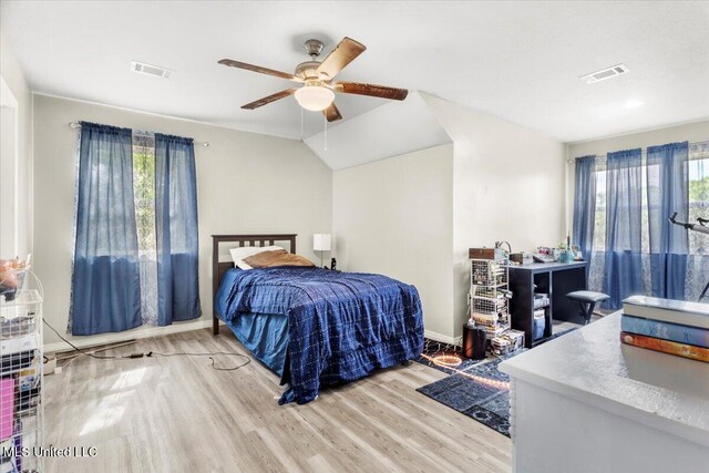 24023 Robert E Lee Rd, Lucedale, MS 39452 - bedroom with visible vents, wood finished floors, and multiple windows