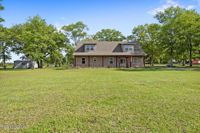24023 Robert E Lee Rd, Lucedale, MS 39452 - cape cod-style house featuring a front yard and brick siding