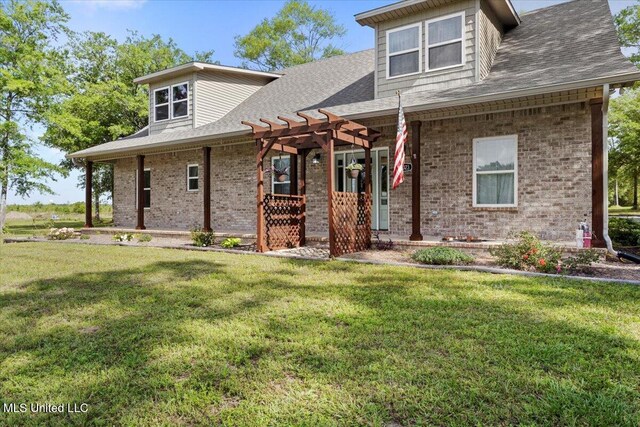 24023 Robert E Lee Rd, Lucedale, MS 39452 - view of front of home with a pergola, a front yard, and brick siding