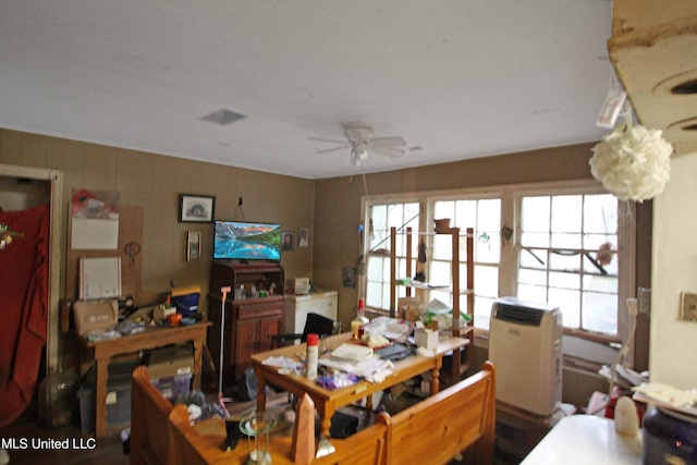 interior space featuring ceiling fan