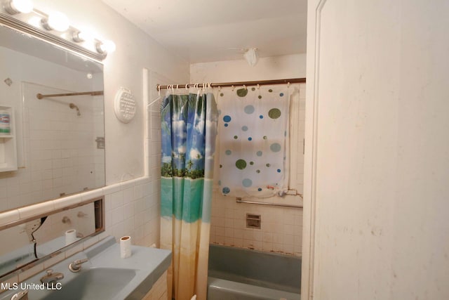 4803 Sheridan Dr, Jackson, MS 39206 - bathroom with tile walls, shower / bath combo, and vanity
