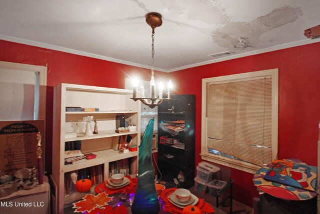 rec room with an inviting chandelier and crown molding