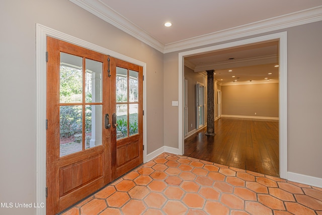 foyer entrance with recessed lighting, baseboards, ornamental molding, and french doors